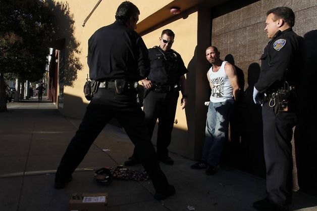 (l to r) Sgt. Troy Carrasco, Officer Mark Hodge and Officer Jordan Oryall, with the San Francisco Police Department out of Southern Station, make an arrest of a burglary suspect on 5th St. near Folsom St. in San Francisco, Calif.  on Wednesday Jan. 2, 2013. Photo: Michael Macor, The Chronicle
